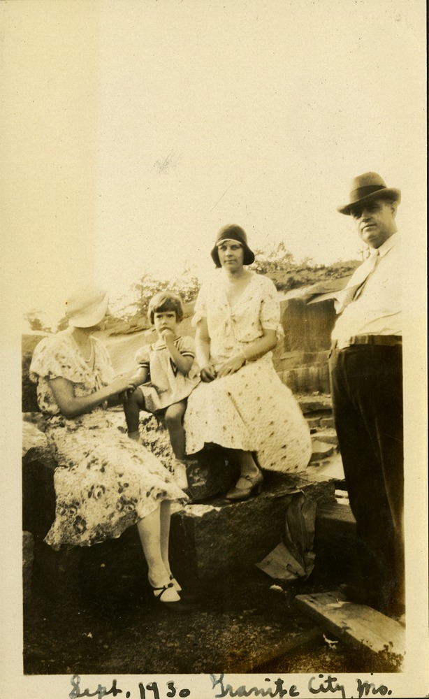 Sept. 30 - Granite City, M.O - two women, man and small child sitting on rocks
