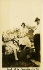 Sept. 30 - Granite City, M.O - two women, man and small child sitting on rocks