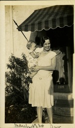March 1930 - Drew - Woman holding a baby outside home