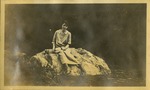 Karven's Cove- Woman sitting on rock in river