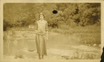 Woman standing near river