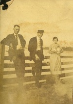 Two men and woman on bridge