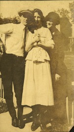 Two women and man posing together