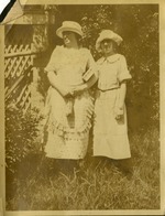 Two Women in hats together in grass