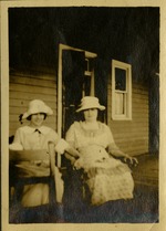 [1921] Two women in hats sitting on porch