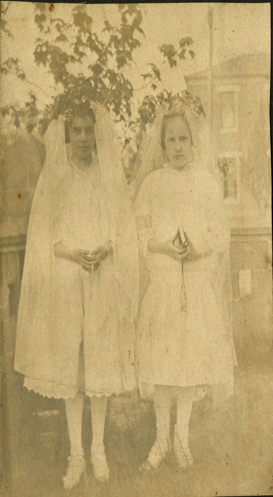 Two young girls in communion outfit