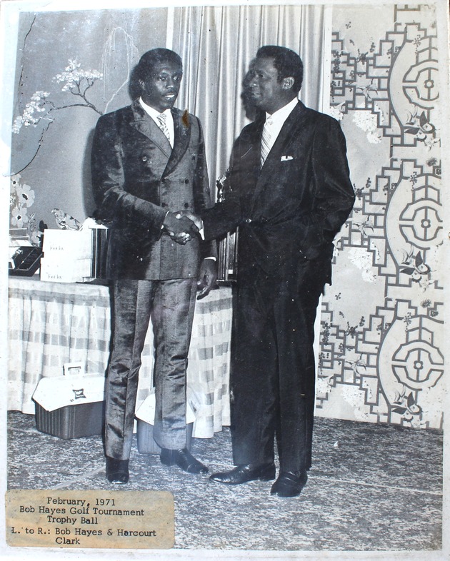 Bob Hayes and Harcourt Clark shake hands at the Bob Hayes Golf Tournament Trophy Ball