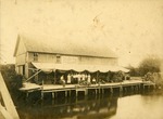 "This is Boynton, Look at the Crops as you Pass. The Best Land is the Cheapest. Come To Boynton." Tomato packing house on canal, Boynton Beach, Florida, c. 1910