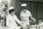Nurses examing a print-out, 1982