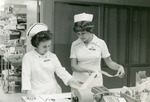 [1982] Nurses examing a print-out, 1982