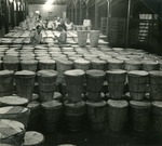 Sealing baskets at the Cooperative Produce Mart, c. 1960