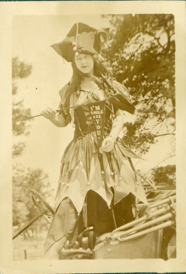 Girl with "I'm Single, Are You" flag, c. 1918