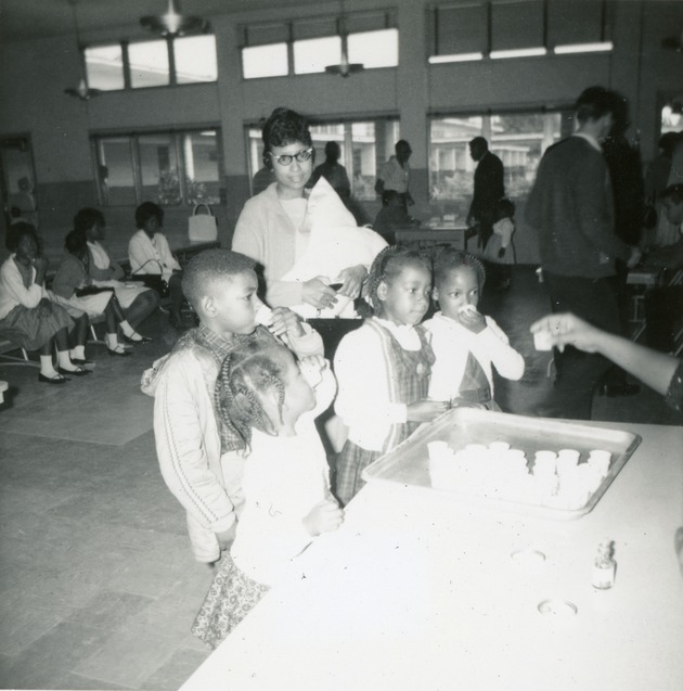 Family receiving polio vaccinations, 1965