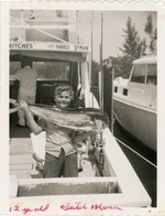 Butch Moser presents his catch, 1958