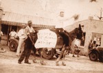 Dewey Hawkins on mule with sign