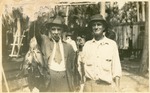 Two unidentified men with their fish catch