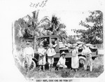 Group of children and adults with watermelon truck