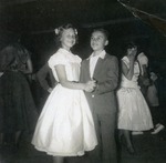 Boy and girl dancing at evening dance