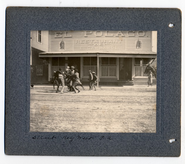 Men fighting in front of a restaurant