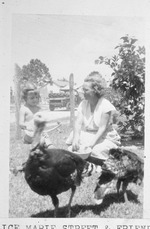 Alice Marie Street with daughter Julia feeding turkeys