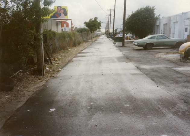 Alley and NW 47th Street looking south