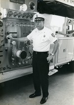 Chief ed Bailey poses by fire truck