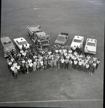 Enitre Oakland Park staff posing with trucks
