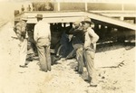 [1925/1929] Men gather at train depot