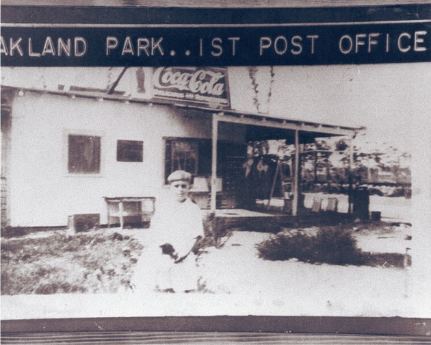 Oakland Park post office with boy posed outside