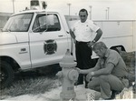 John Sullivan and Jim Lee inspecting fire hydrant