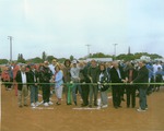 Color photo ribbon cutting at Thompson Field