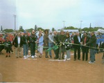 Color photo ribbon cutting at Thompson Field
