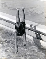 Boy diving in to pool