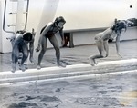 Girls jumping into pool