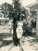 Woman in Bathing Suit by Tree
