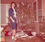Gail Goodbread posed with Christmas Tree