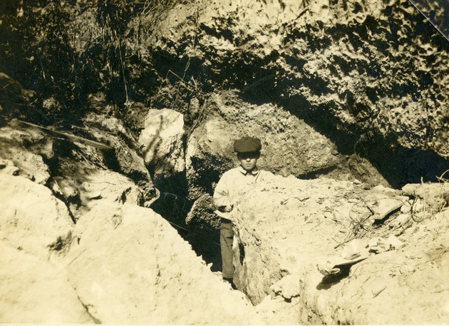 Charles Leon Pierce at mouth of cave, c. 1906