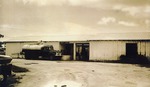 [1955/1960] Feed truck outside of Weaver Dairy building, c. 1950s