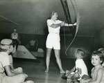 Children watch archery demonstration, 1963