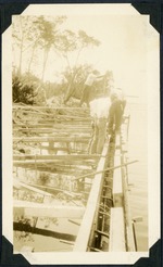 Workman building a seawall, c. 1925