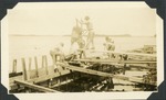 Workmen building a seawall, c. 1925