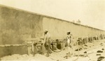 Workmen spraying wall during repair of Ocean Boulevard near Boynton Inlet, 1927