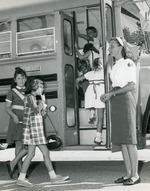 Children getting on schoolbus, 1966