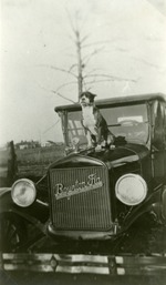 Dog on car, c. 1913