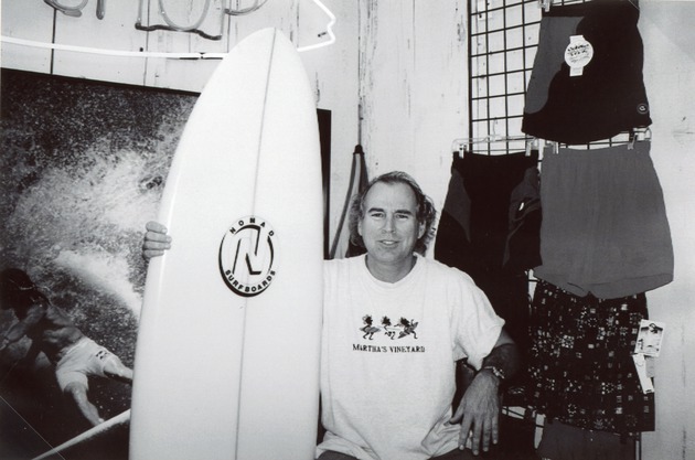 Singer Jimmy Buffett with a NOMAD surfboard, c. 1968