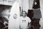 [1965/1969] Singer Jimmy Buffett with a NOMAD surfboard, c. 1968