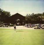 Boynton Beach Links clubhouse with golf carts and golfer, 1993