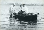 Crossing Lake Worth by rowboat, c. 1925