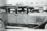 Car in front of Byrds Pharmacy, c. 1923