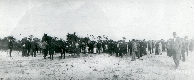 Gathering listening to speaker, c. 1919